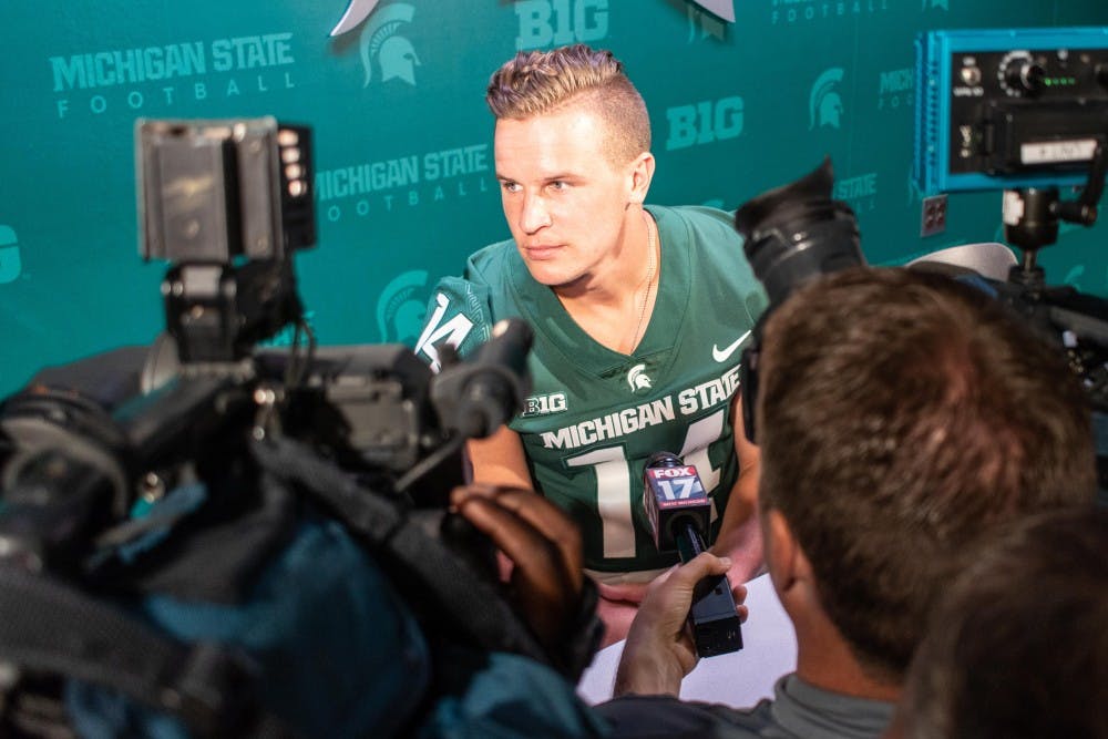 Redshirt junior quarterback Brian Lewerke (14) speaks to the media on Aug. 6 at Spartan Stadium.