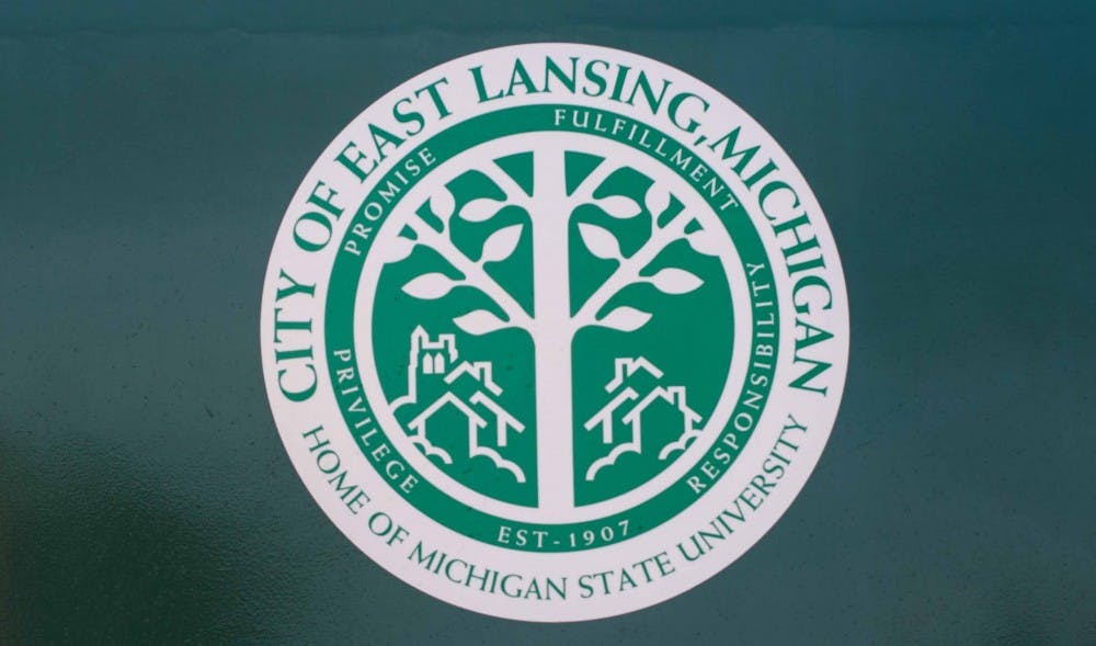 The City of East Lansing logo from a recycling bin at the East Lansing Public Works Department headquarters on March 20, 2018. (Annie Barker | State News)