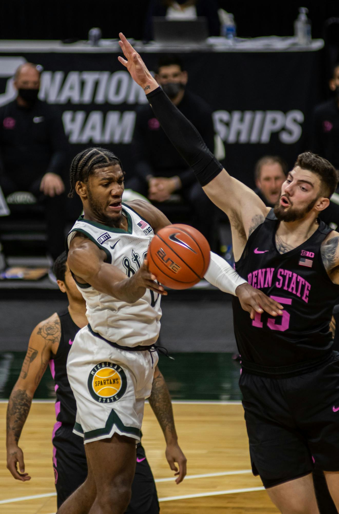 <p>Junior forward Aaron Henry drives into the lane and passes. Henry&#x27;s 20-point night helped the Spartans win against Penn State on Feb. 9, 2021.</p>