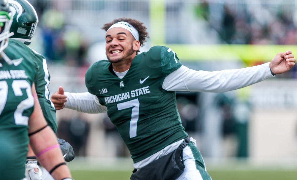 Sophomore wide receiver Cody White (7) celebrates on the sidelines during the game against Purdue on Oct. 27, 2018 at Spartan Stadium. The Spartans defeated the Boilermakers 23-13.