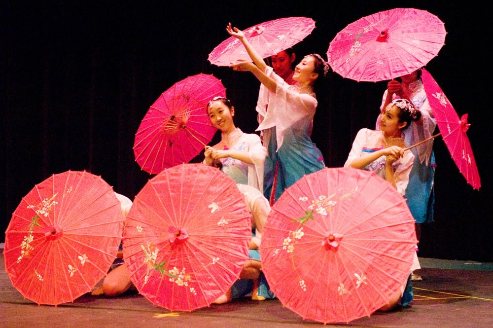 Dancers from Jilin University in China performed at Lansing Community College's Dart Auditorium to celebrate the Chinese New Year.  These performers are presenting a classical Chinese dance of hope called "Recite the Spring Rain." Alex McClung/The State News