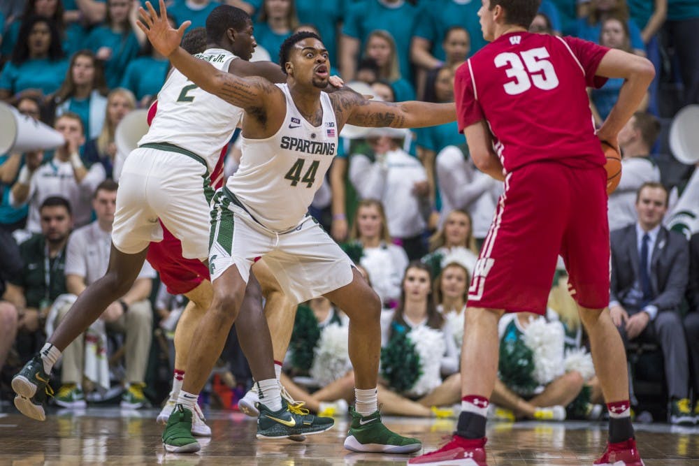 Sophomore forward Nick Ward (44) covers Wisconsin forward Nate Reuvers (35) during the first half of the men's basketball game against Wisconsin on Jan. 26, 2018 at Breslin Center. The Spartans defeated the Badgers, 76-61. (Nic Antaya | The State News)