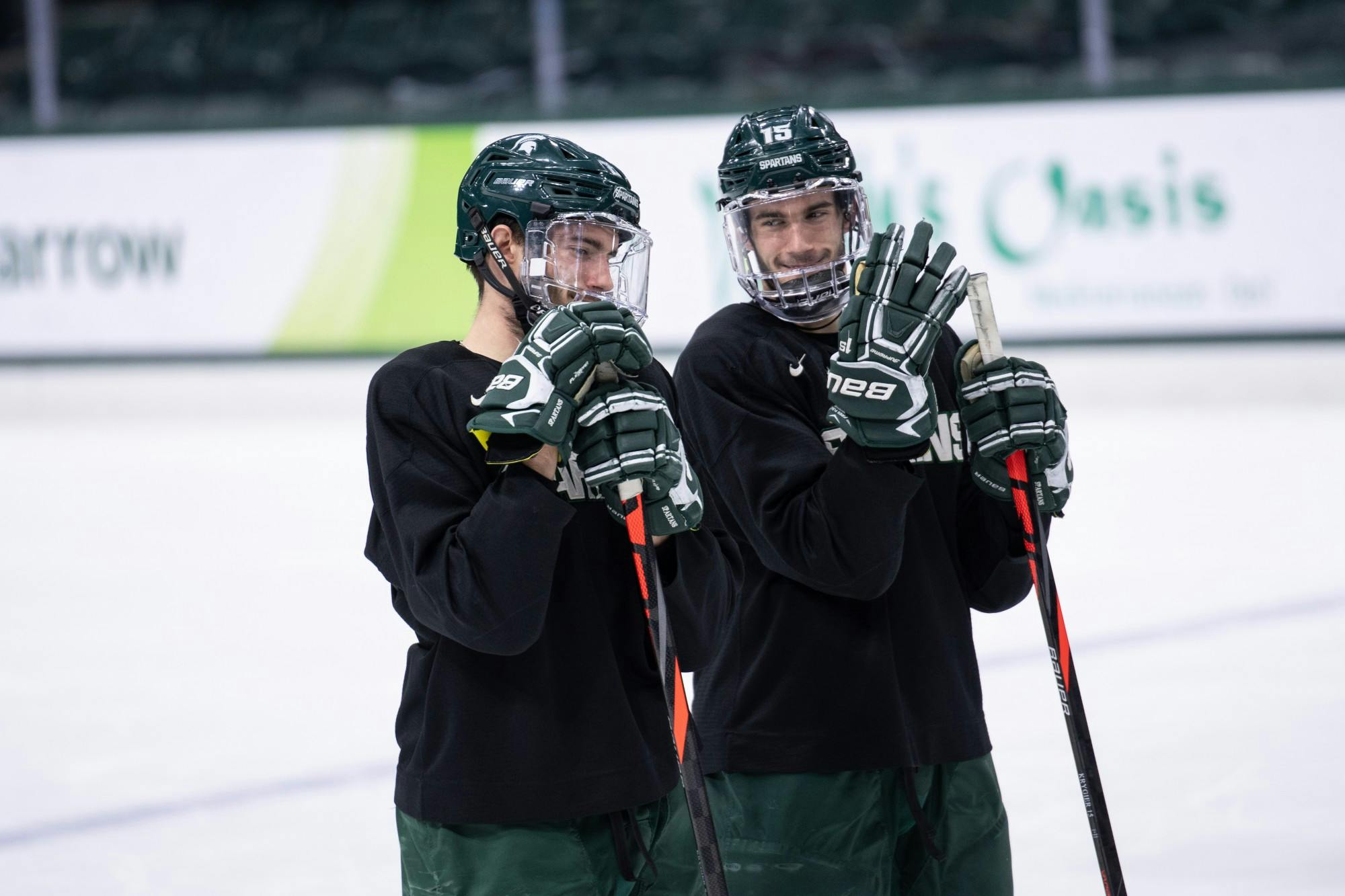 <p>Cole (left) and Christian (right) Krygier are pictured at practice Nov. 5, 2019 at Munn Ice Arena.</p>