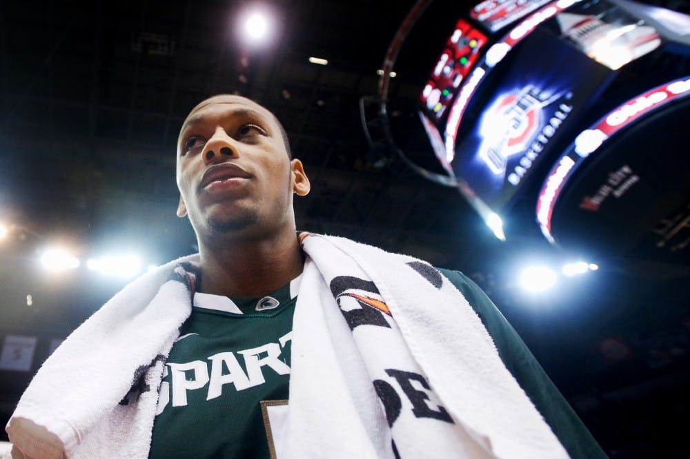 Sophomore center Adreian Payne walks off the court after a win against the Ohio State Buckeyes, 58-48, Saturday night at Schottenstein Center at Columbus, Ohio. Payne contributed 15 points for the Spartans. Justin Wan/The State News