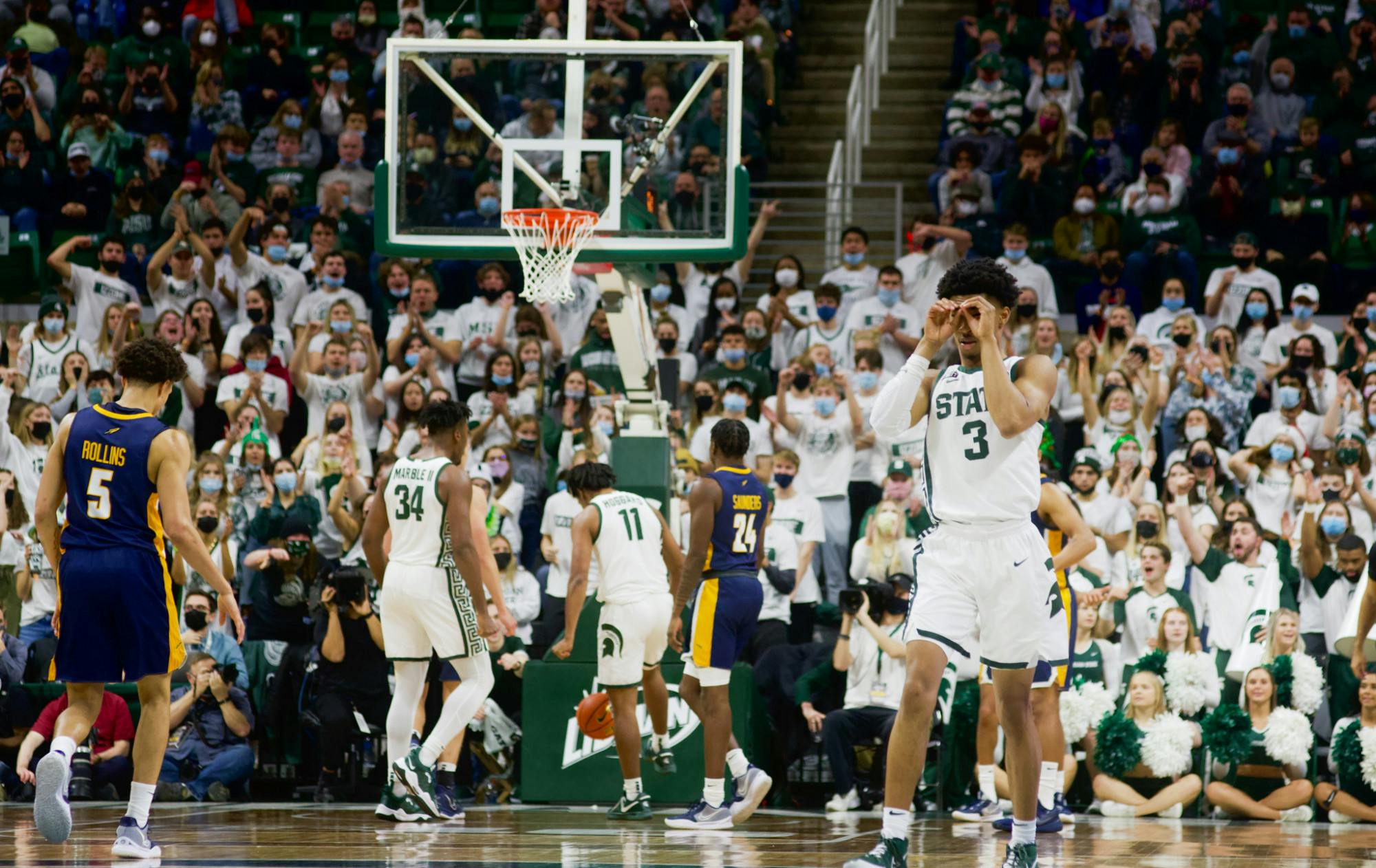 <p>Freshman guard Jaden Akins celebrates play during the matchup against Toledo on Dec. 4, 2021. </p>