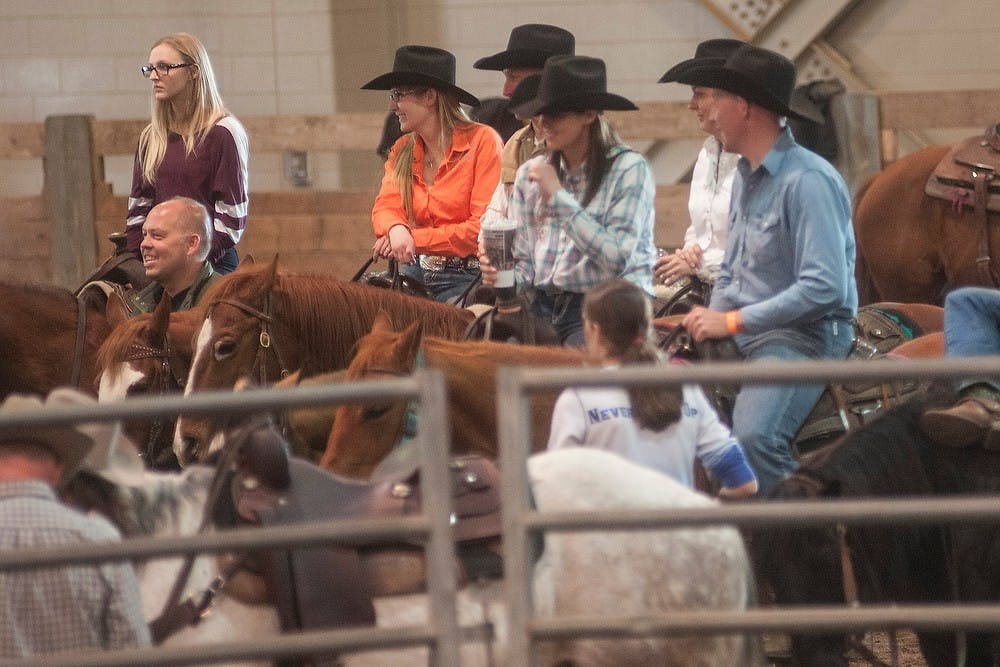 <p>Team Sorting participants watch their competitors perform March 15, 2015, at the International Stallion Exhibition and Trade Show at the MSU Pavilion. Allyson Telgenhof/The State News.</p>