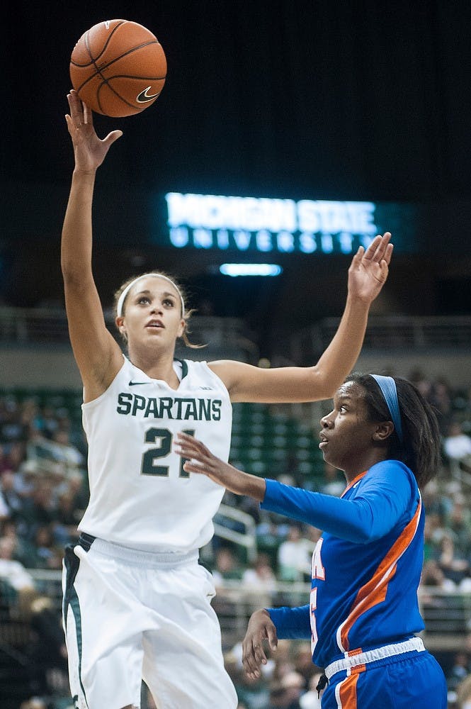 	<p>Junior guard Klarissa Bell goes up for one of her 16 field goal attempts with UT Arlington guard Kiara Parker in defense. The spartans defeated the Mavericks, 83-39, on Nov. 11, 2012 at Breslin Center. Justin Wan/The State News</p>