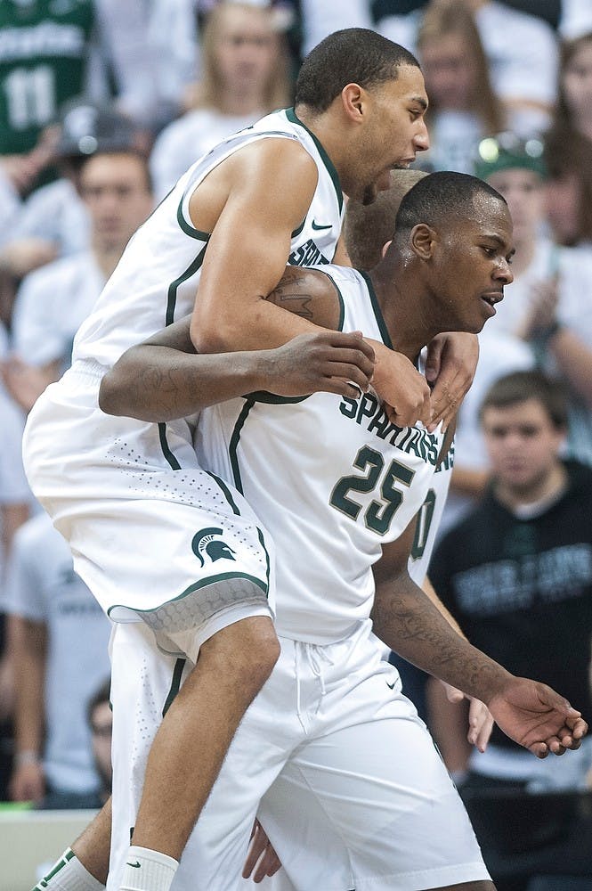 	<p>Freshman guard Denzel Valentine celebrates with senior center Derrick Nix to celebrate a favorable foul call against Arkansas-Pine Bluff. The Spartans take on Tuskegee Saturday night in a game inside Jenison Field House.  Justin Wan/The State News</p>