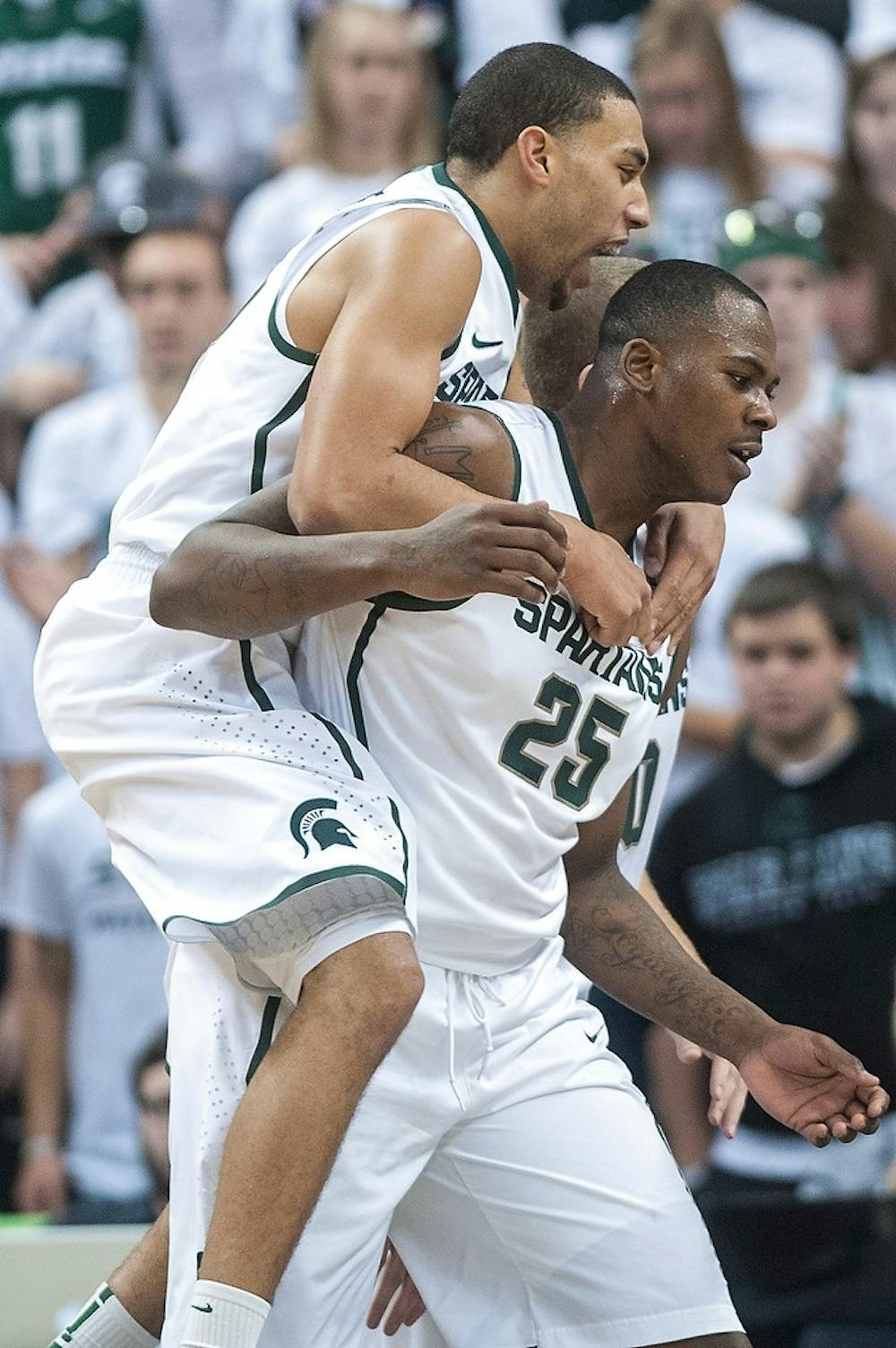 	<p>Freshman guard Denzel Valentine celebrates with senior center Derrick Nix to celebrate a favorable foul call against Arkansas-Pine Bluff. The Spartans take on Tuskegee Saturday night in a game inside Jenison Field House.  Justin Wan/The State News</p>