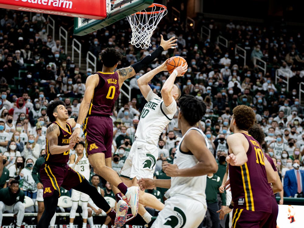 <p>Redshirt senior forward Joey Hauser hits the game-winner against Minnesota in the final second of the game, giving the Spartans a 71-69 win at the Breslin on Jan. 12, 2022.</p>