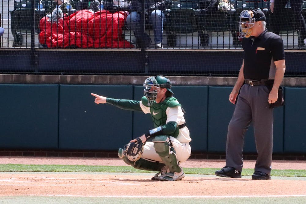 <p>A Spartan catcher signals after a play in the matchup against Penn State at McLane Baseball Stadium on April 21, 2024.</p>