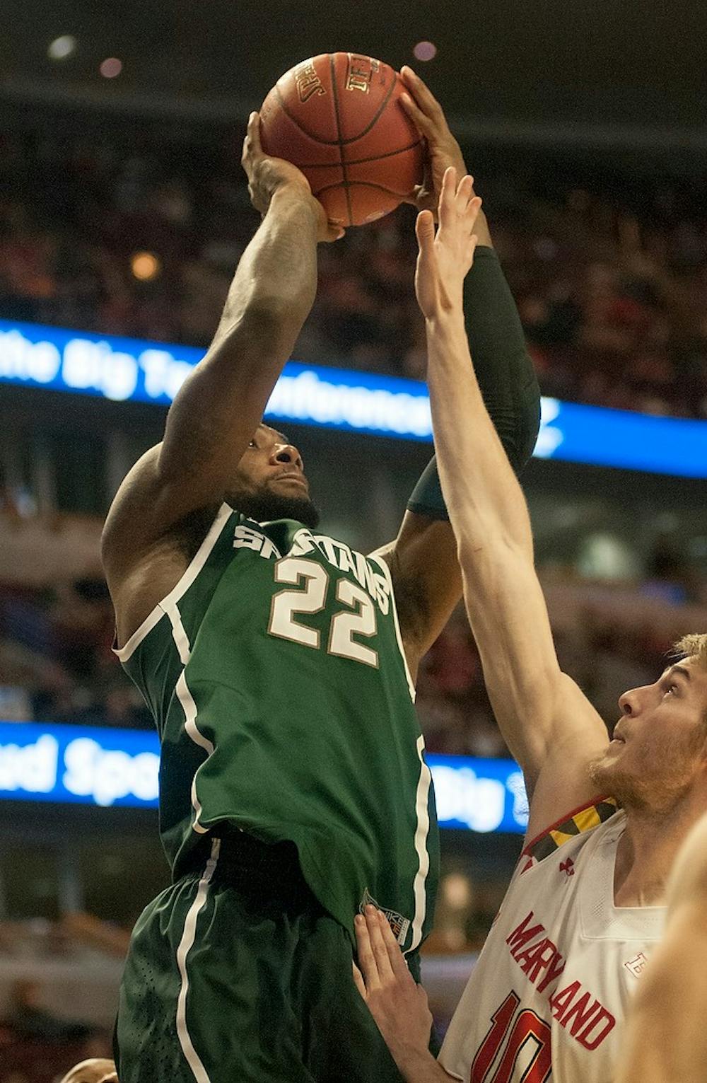 <p>Senior forward/guard Branden Dawson takes a shot over Maryland junior forward Jake Layman Mar. 14, 2015, during the game against Maryland at the Big Ten Tournament at United Center in Chicago. The Spartans defeated the Terrapins, 62-58. Kelsey Feldpausch/The State News</p>