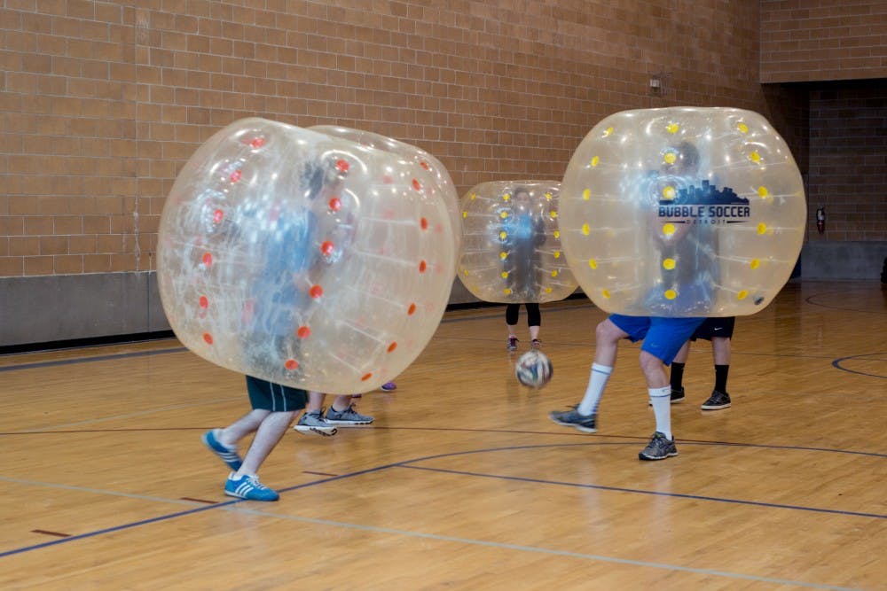 Students participate in bubble soccer on Jan. 10, 2016 at Pruden Street Gym on 727 Prudden Street in Lansing. Many students and Lansing residents participate in this activity which involves playing soccer while inside of a plastic bubble. 