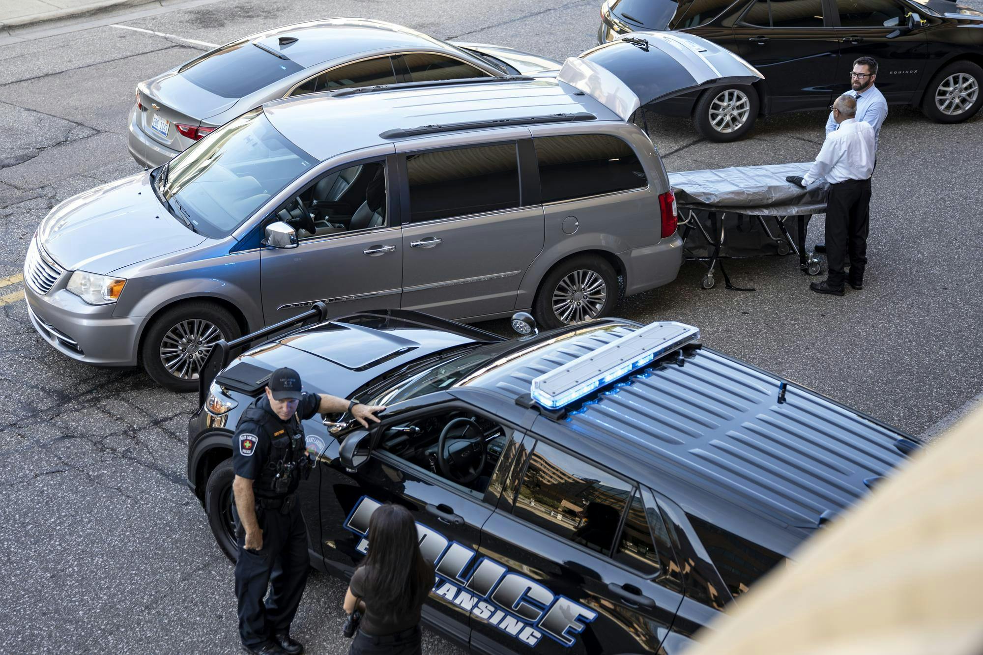 <p>Police and medical respond on scene after a reported fatality on North of Division Street Garage in East Lansing, Mich., on Tuesday, Sep. 16, 2025.</p>