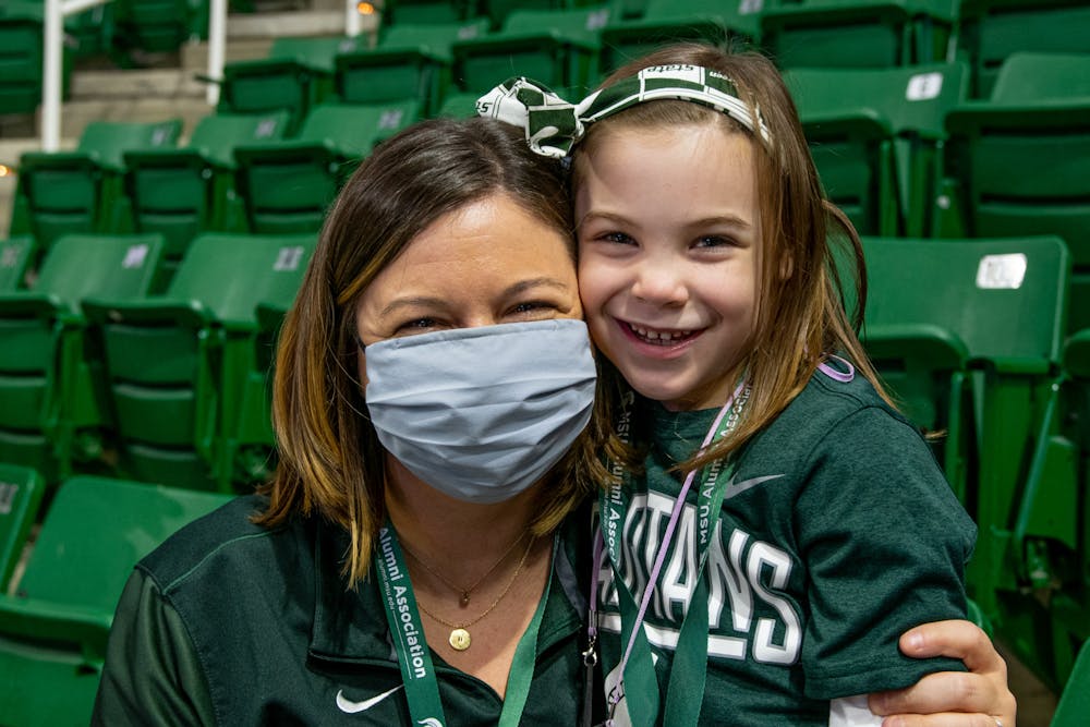 Pamela and Cecelia Jones pose for a portrait at Michigan State's women's basketball game against Notre Dame on Dec. 2, 2021.