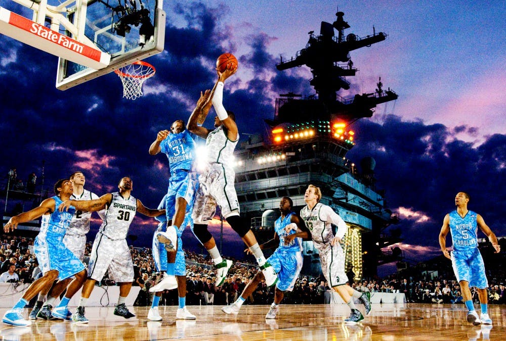 Sophomore center Adreian Payne goes up for a jump shot as the sun sets behind the deck of the U.S.S. Carl Vinson on Friday evening for the Quicken Loans Carrier Classic at Naval Base Coronado in Coronado, CA. The Tar Heels defeated the Spartans, 67-55. State News File Photo