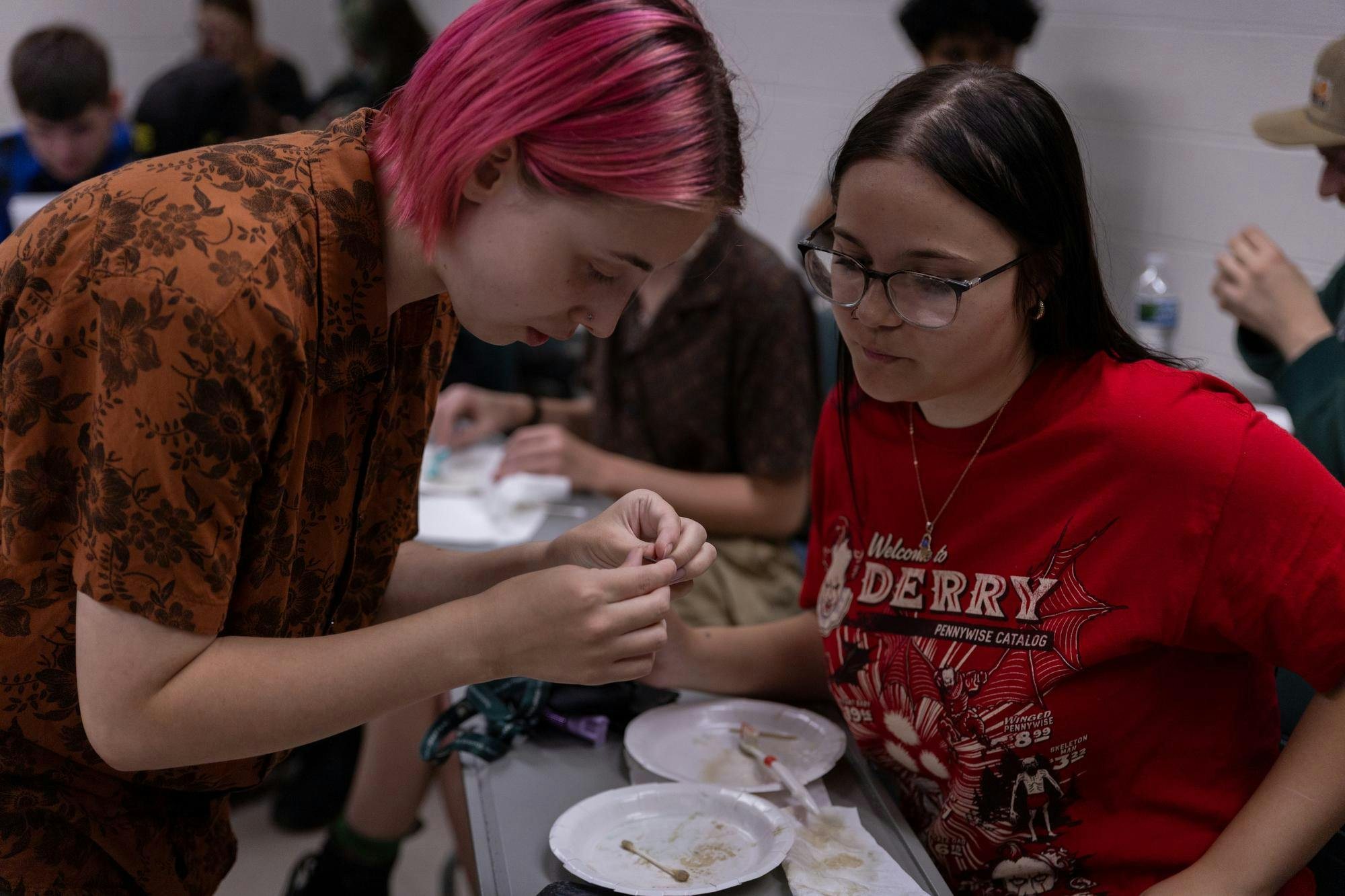 <p>Michigan State sophomore AJ Cousineau, president of the MSU Classical Society, helps another student clean their Roman coin during the MSU Classical Society meeting at Wells Hall in East Lansing, Mich., on Tuesday, Oct. 13, 2026.</p>