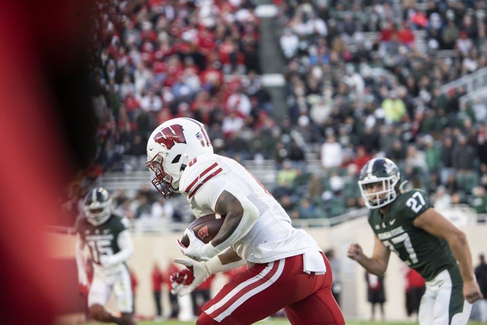 Redshirt Sophmore linebacker Cal Haladay (27) runs after a Wisconson player during the game against Wisconson on October 15, 2022.