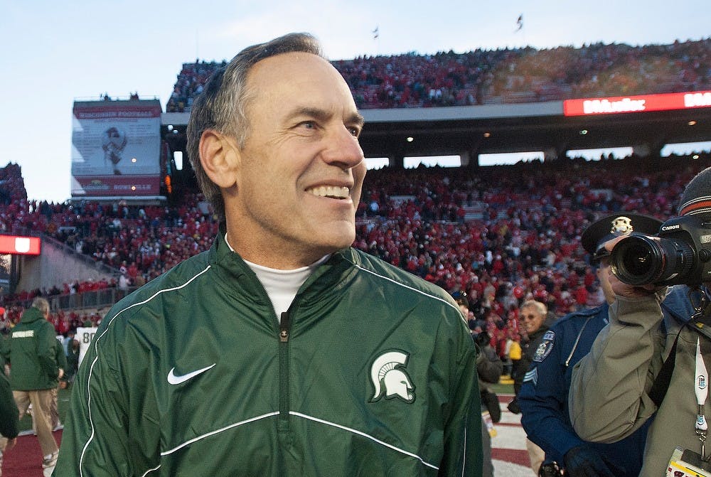 Head coach Mark Dantonio smiles after defeating Wisconsin in overtime, 16-13, on Saturday afternoon, Oct. 27, 2012, at Camp Randall Stadium in Madison, Wisc. Justin Wan/The State News