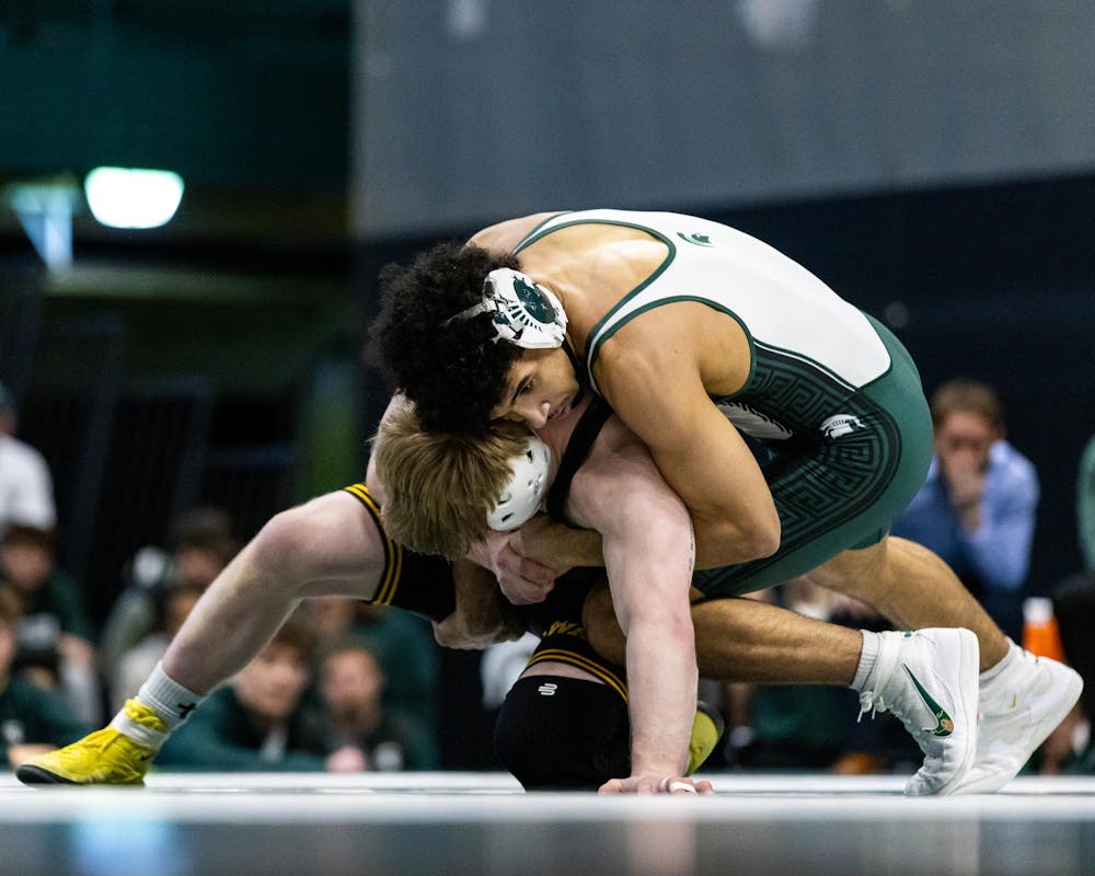 MSU R-Fr. Wt. 157, Darius Marines, wraps around his Iowa opponent in the Jenison Field House in East Lansing, MI on Feb. 8, 2026.