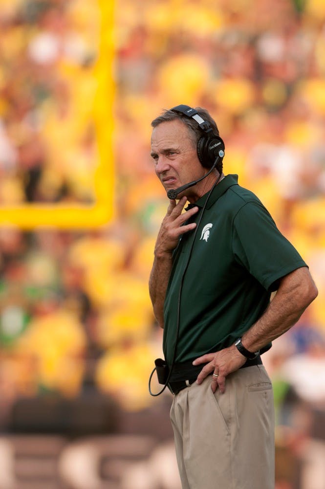 <p>Head coach Mark Dantonio reacts to the fourth quarter of the game against Oregon on Sept. 6, 2014, at Autzen Stadium in Eugene, Ore. The Spartans lost to the Ducks, 46-27. Julia Nagy/The State News</p>