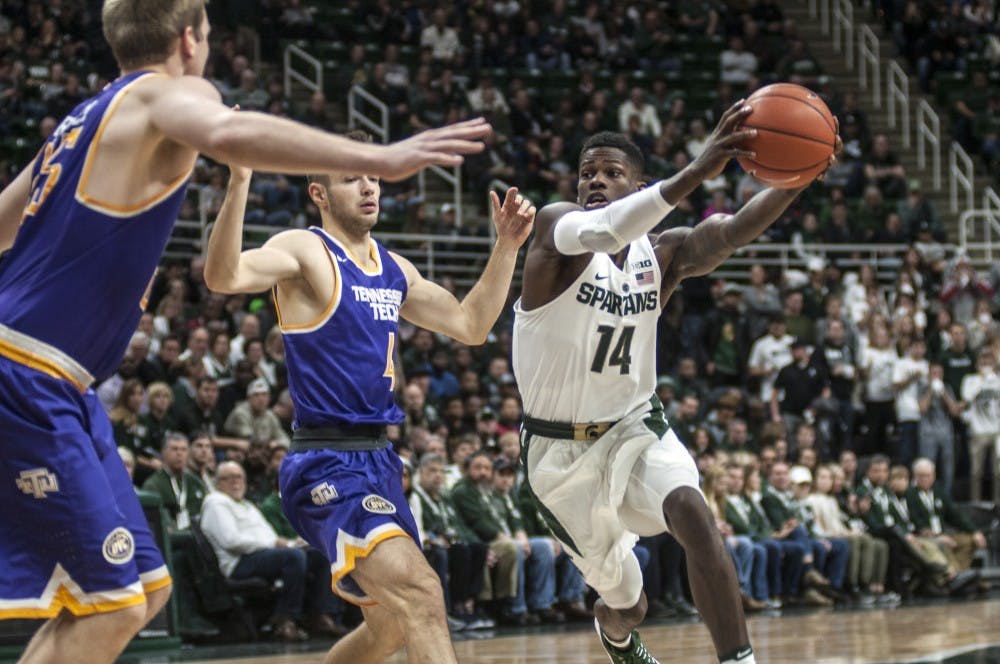Senior guard Eron Harris (14) takes the ball to the basket during the men's basketball game against Tennessee Tech on Dec. 10, 2016 at Breslin Center. 