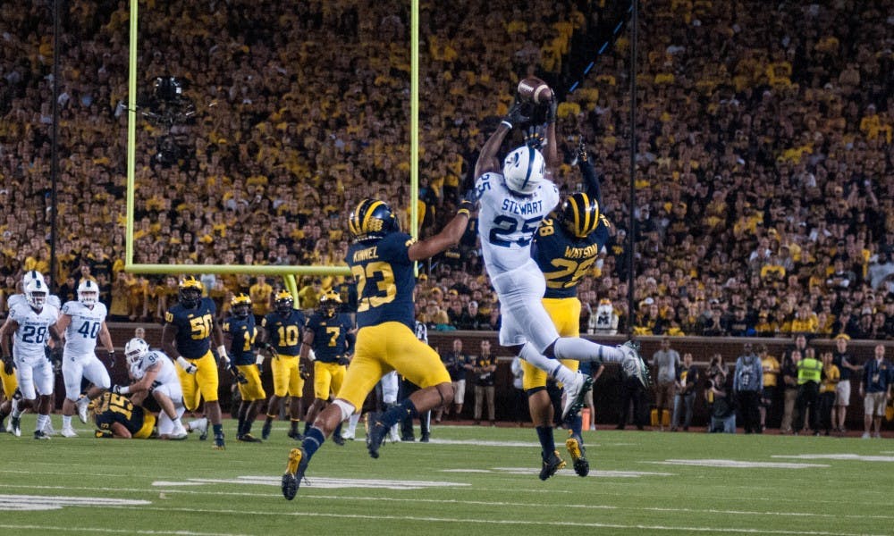 Junior wide receiver Darrell Stewart (25) catches the ball as U of M defensive back Tyree Kinnel (23) and U of M defensive back Brandon Watson (28) try to block the pass during the game against University of Michigan on Oct. 7, 2017, at Michigan Stadium. The Spartans defeated the Wolverines 14-10.