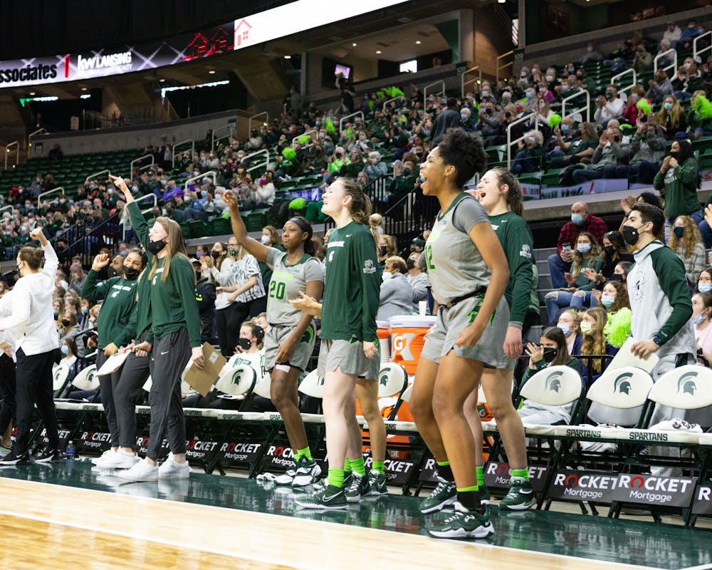 <p>The Michigan State University women’s basketball team cheers during the Spartans&#x27; 65-46 win against Northwestern on Jan. 16, 2022. </p>