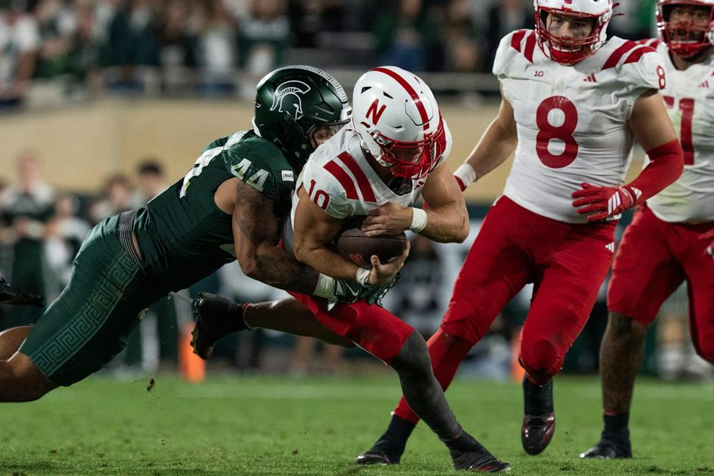 <p>Michigan State senior linebacker Caleb Wheatland (44) tackles Nebraska senior quarterback Anthony Colandrea (10) during the Spartans’ game against Nebraska at Spartan Stadium in East Lansing, Mich., on Saturday, Sept. 26, 2026.</p>