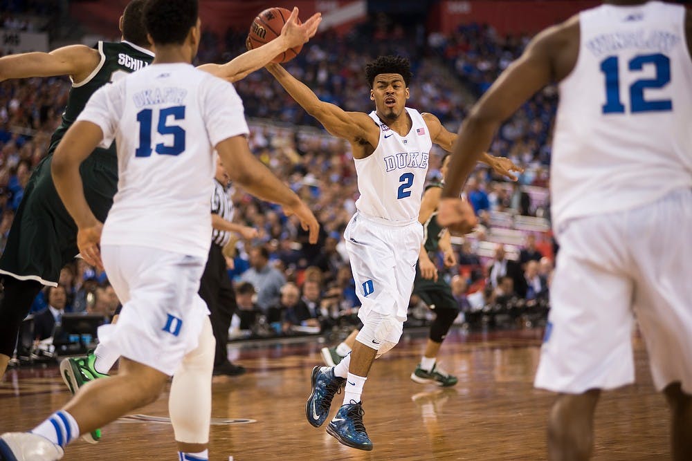 <p>Duke guard Quinn Cook steals the ball from sophomore forward Gavin Schilling April 4, 2015, during the semi-final game of the NCAA Tournament in the Final Four round at Lucas Oil Stadium in Indianapolis, Indiana. The Spartans were defeated by the Blue Devils, 81-61. Erin Hampton/The State News</p>