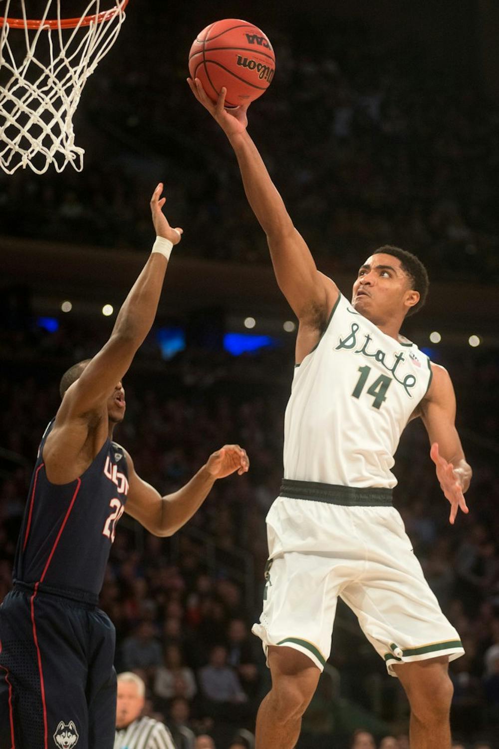 <p>Sophomore guard Gary Harris goes up for the basket as Connecticut guard/forward Lasan Kromah guards March 30, 2014, during the Elite Eight at Madison Square Garden in New York City. MSU lost, 60-54. Julia Nagy/The State News</p>