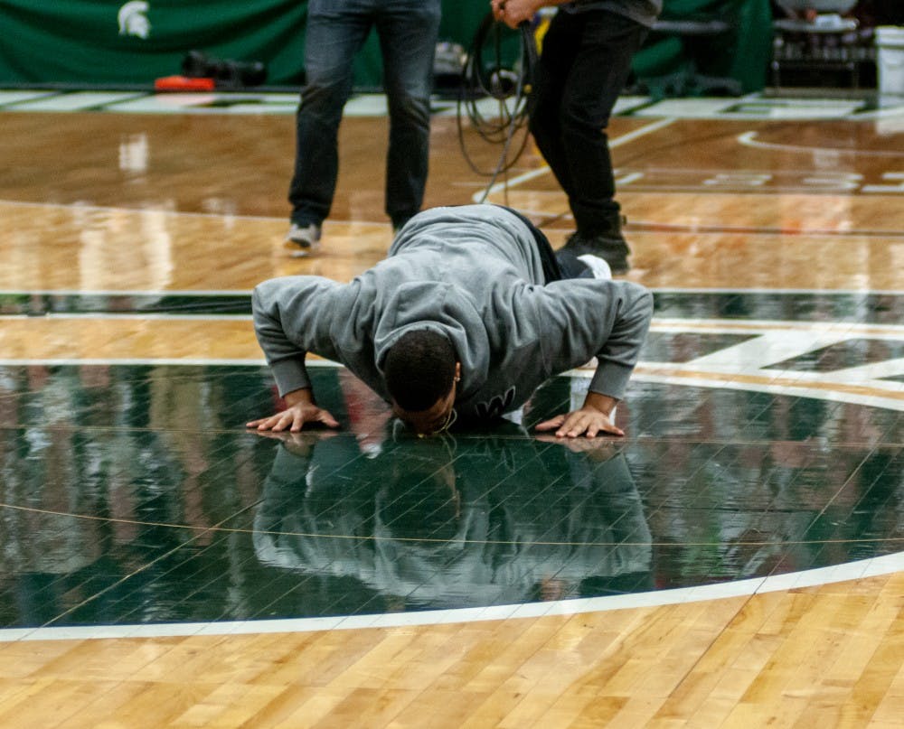 <p>Alumnus Miles Bridges kisses the Spartan head prior to the mens basketball game against Maryland on Jan. 21, 2019 at Breslin.</p>