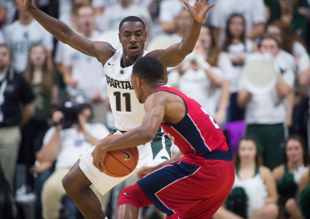 <p>Sophomore guard Lourawls 'Tum Tum' Nairn Jr. defends Florida Atlantic guard Marquan Botley during the second half of the game against Florida Atlantic on Nov. 13, 2015 at Breslin Center. The Spartans defeated the Owls, 82-55.</p>