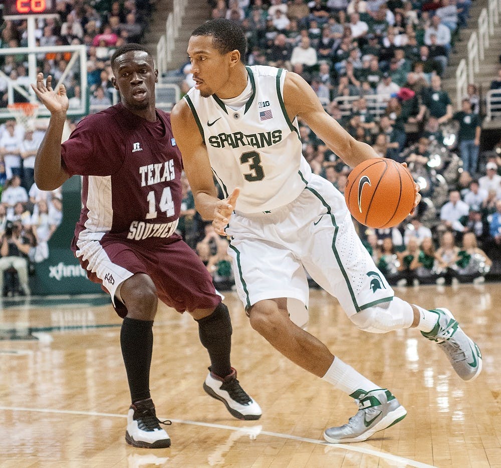 	<p>Sophomore guard Brandan Kearney dribbles the ball as Texas Southern&#8217;s guard Raymond Penn defends Nov. 18, 2012, at Breslin Center. The Spartans beat the Tigers 69-41. Natalie Kolb/The State News</p>