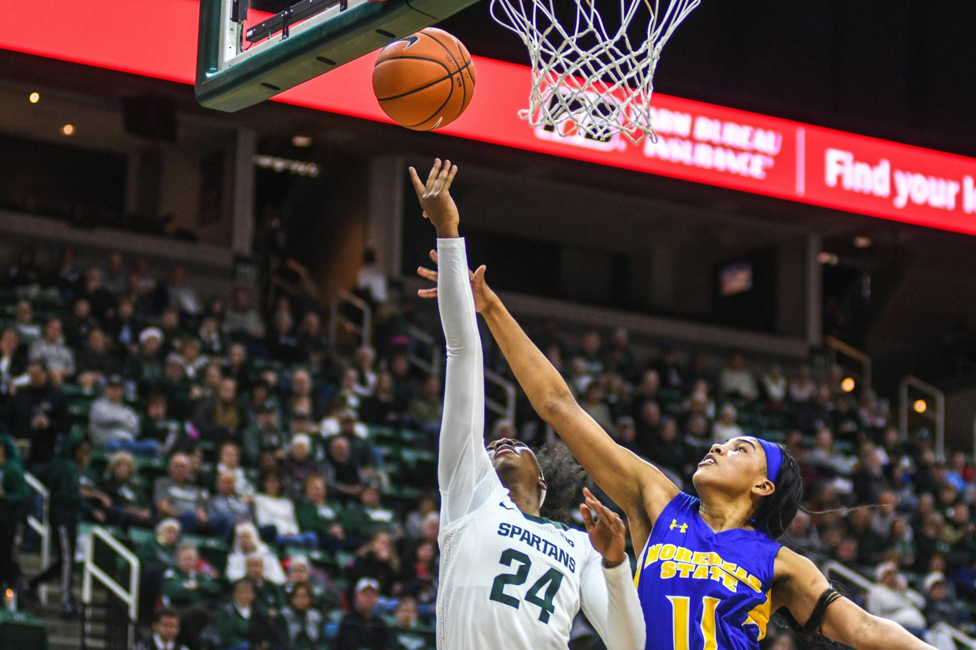 <p>Sophomore guard Nia Clouden (24) shoots the ball during the game against Morehead State on Dec. 15, 2019 at Breslin Center. The Spartans defeated the Eagles, 93-48.</p>