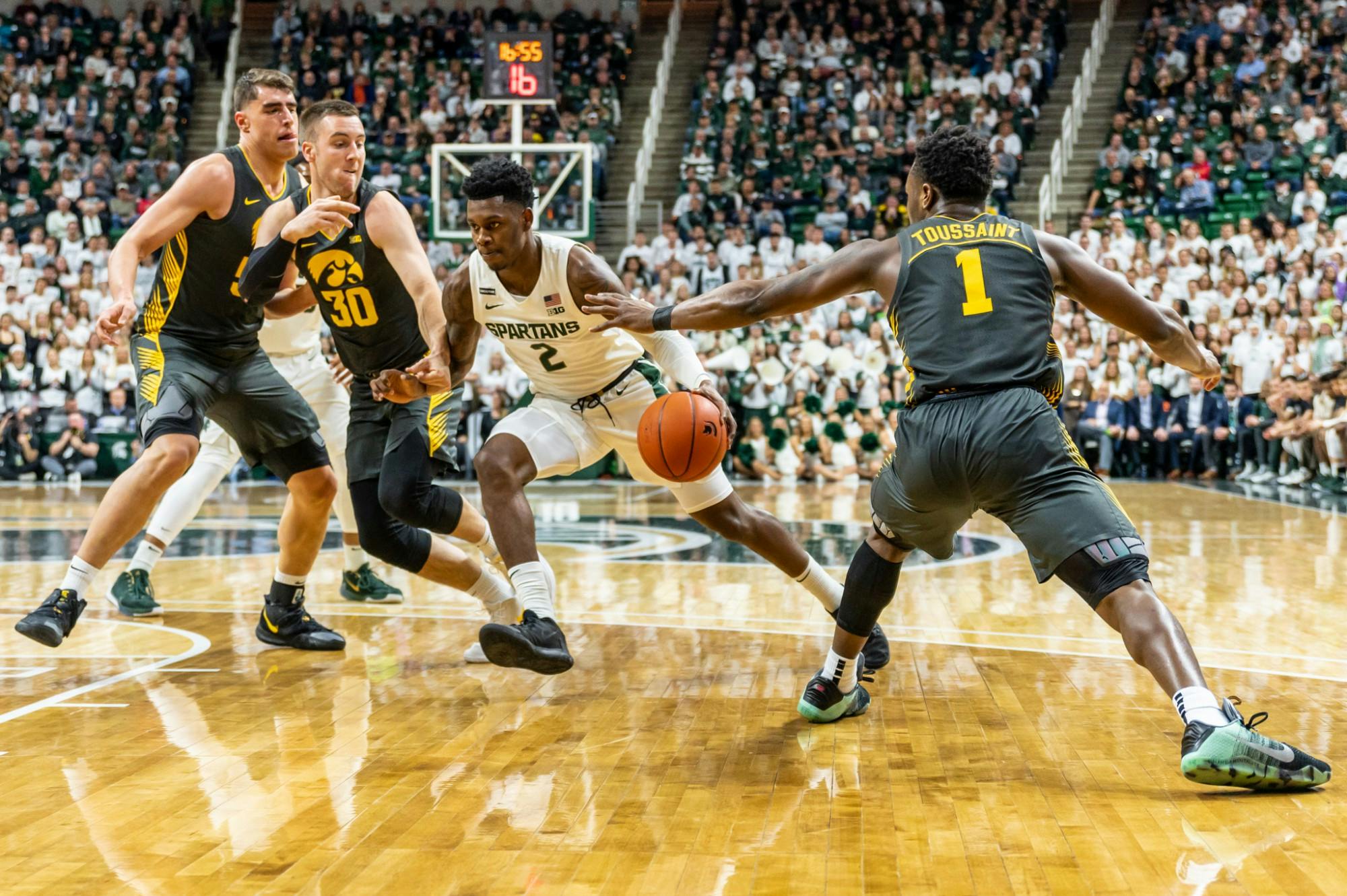 <p>Sophomore guard Rocket Watts (2) drives through Iowa defenders. The Spartans defeated the Hawkeyes, 78-70, at the Breslin Student Events Center on Feb. 25, 2020. </p>