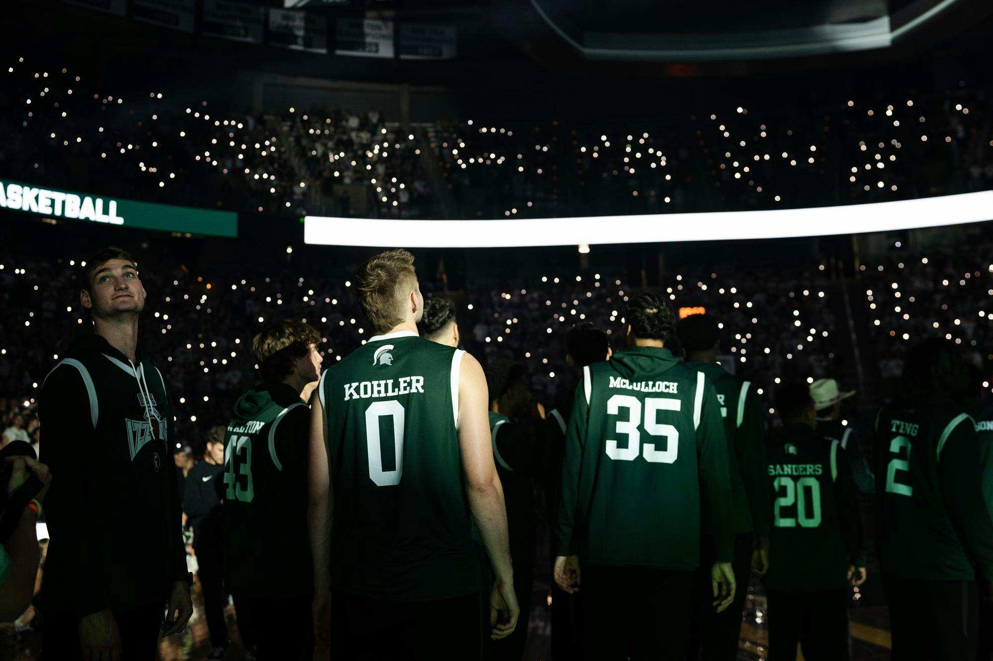 Michigan State men's basketball team looking at the crowd of March Madness at the Breslin Center on Oct. 4, 2024. 