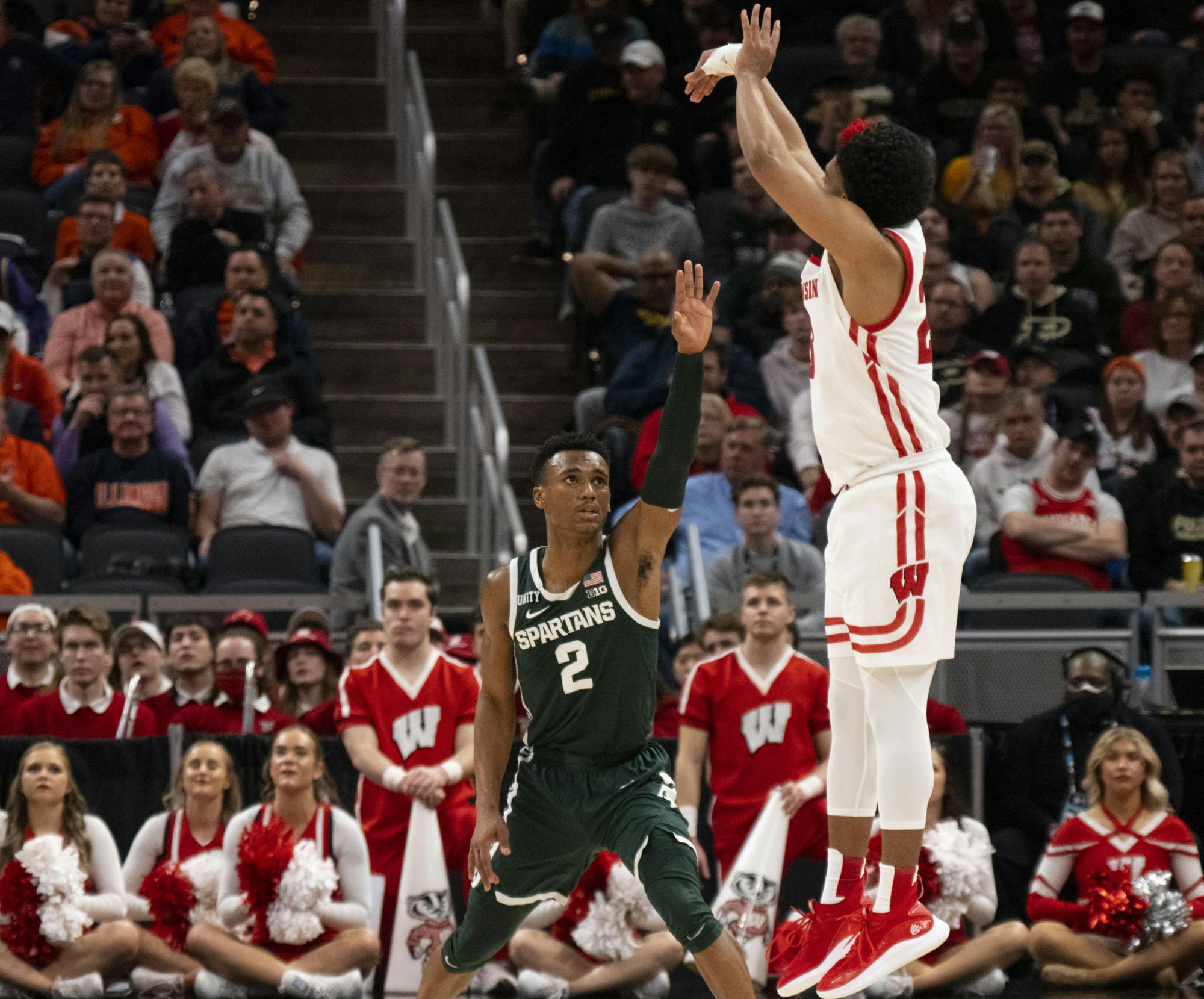 <p>Wisconsin attempts a final basket in their game against Michigan State, but fails to make the points. The Badgers ultimately fell to the Spartans 69-63 in the quarterfinals of the B1G Tournament at Gainbridge Fieldhouse in Indianapolis, Indiana. - March 11, 2022. </p>