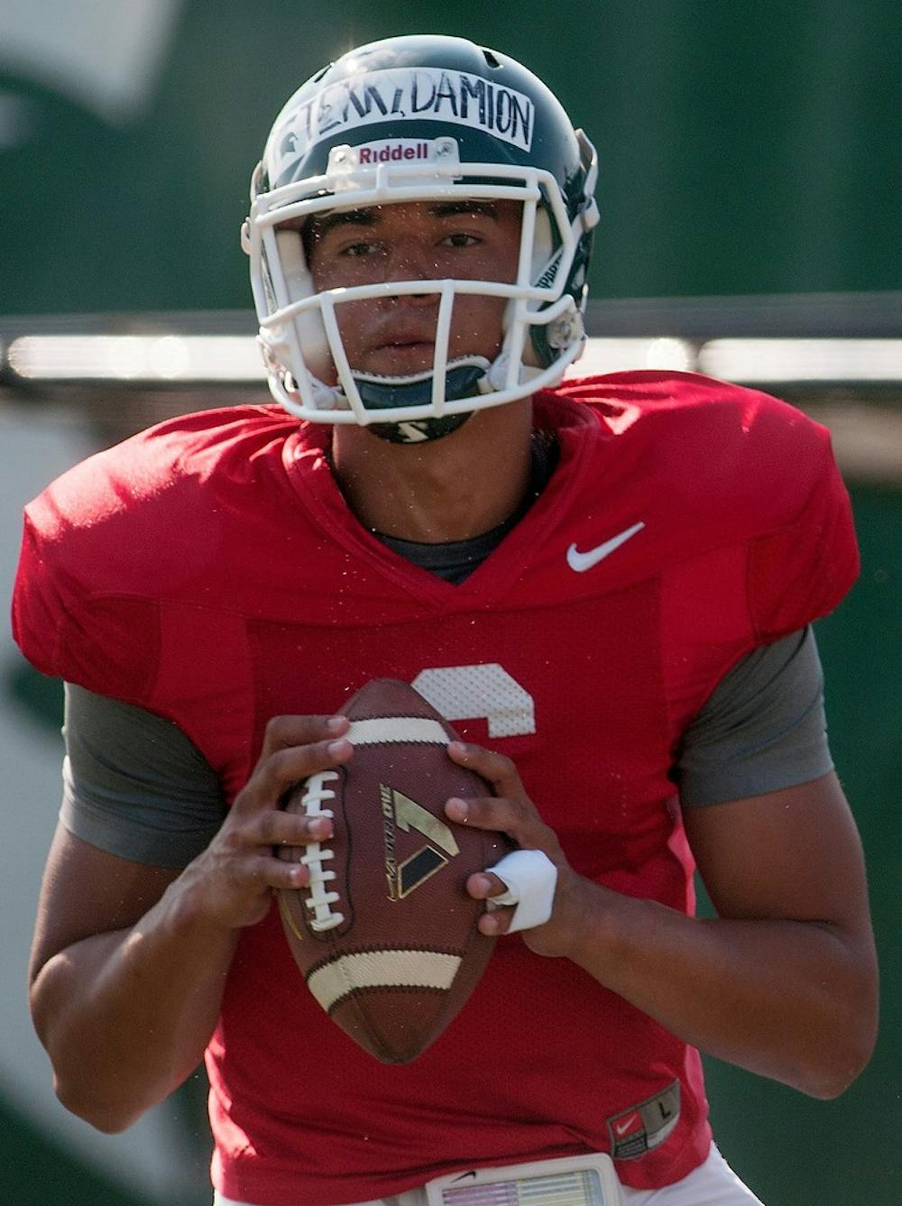 	<p>Freshman quarterback Damion Terry looks to throw the ball during practice Aug. 19, 2013, at the practice field outside Duffy Daugherty Football Building. Julia Nagy/The State News</p>