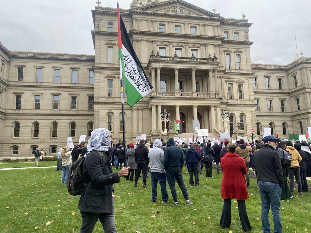 <p>East Lansing residents, members of Students United for Palestine and people from the Islamic Center of East Lansing gather on the Lansing Capitol lawn on Oct. 29, 2023.</p>