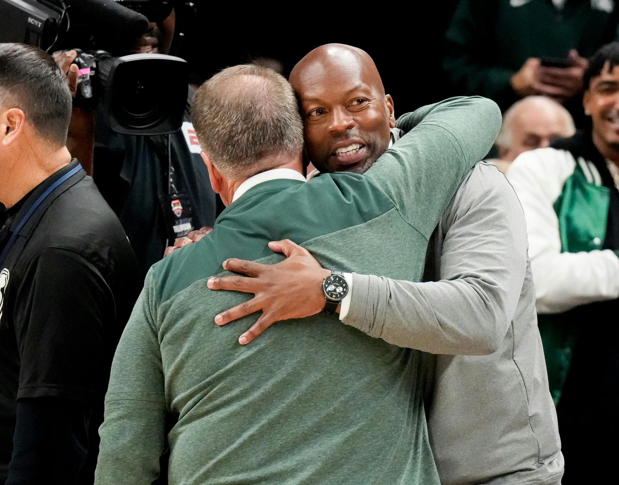 <p>Athletic director Alan Haller embraces head coach Tom Izzo after Michigan State secured an upset win against University of Kentucky at the Champions Classic in Indianapolis at Gainbridge Fieldhouse on Nov. 15, 2022. The Spartans came away with the win with a score of 86-77.</p>