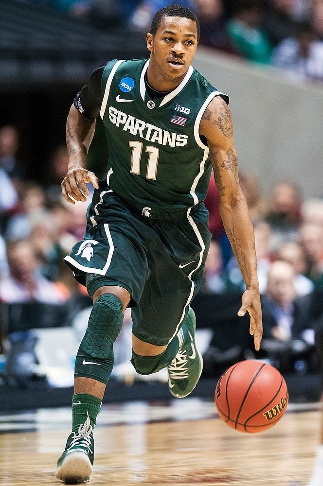 	<p>Junior guard Keith Appling dribbles the ball up the court Friday, March. 29, 2013, at Lucas Oil Stadium in Indianapolis, Ind. The Duke Blue Devils defeated the Spartans, 71-61, in the Sweet Sixteen of the <span class="caps">NCAA</span> Tournament and now advance to the Elite Eight. Adam Toolin/The State News</p>