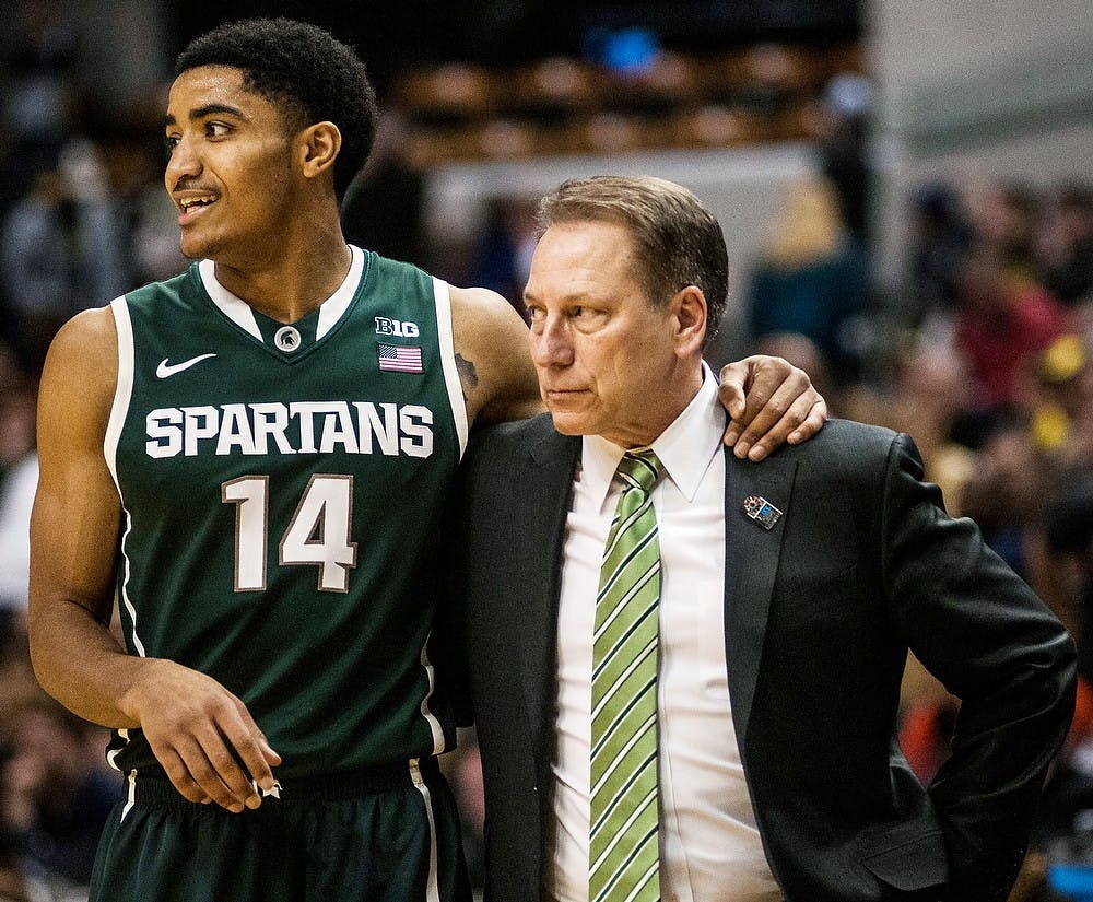 <p>Head coach Tom Izzo puts his arm around sophomore guard Gary Harris March 16, 2014 during a game against Michigan for the Big Ten championship at Bankers Life Fieldhouse in Indianapolis. The Spartans defeated the Wolverines, 69-55. Erin Hampton/ The State News</p>