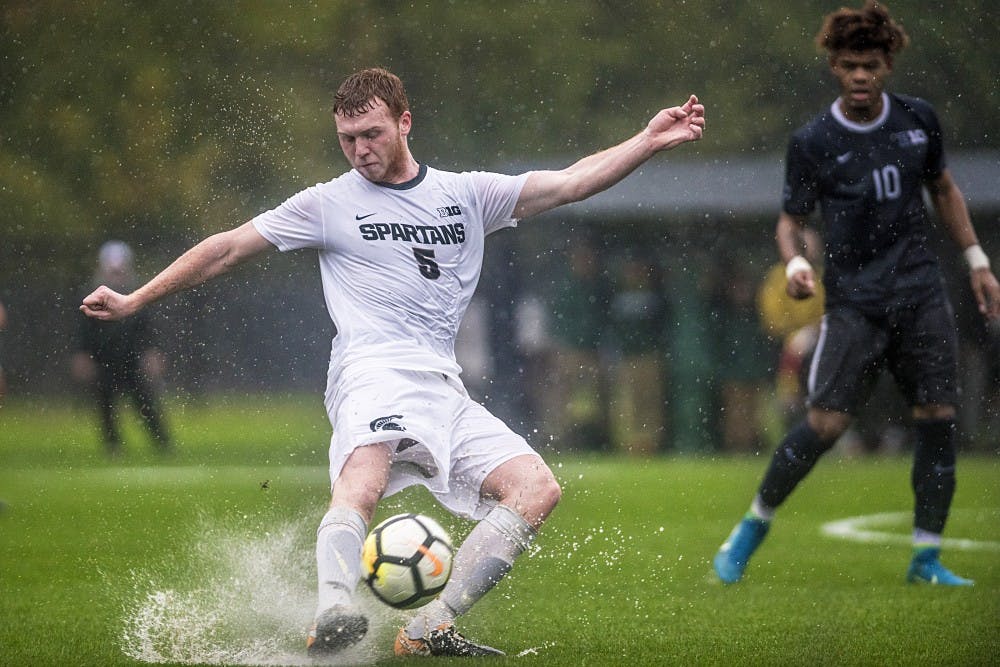 Sophomore defense Michael Pimlott (5) passes the ball during the game against Penn State on Oct. 14, 2017 at DeMartin Stadium. The Spartans defeated the Nittany Lions in the pouring rain, 1-0.