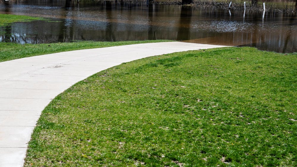 Flooding is pictured along the Red Cedar River on Michigan State University’s campus in East Lansing, Mich., on Tuesday, May 7, 2026.