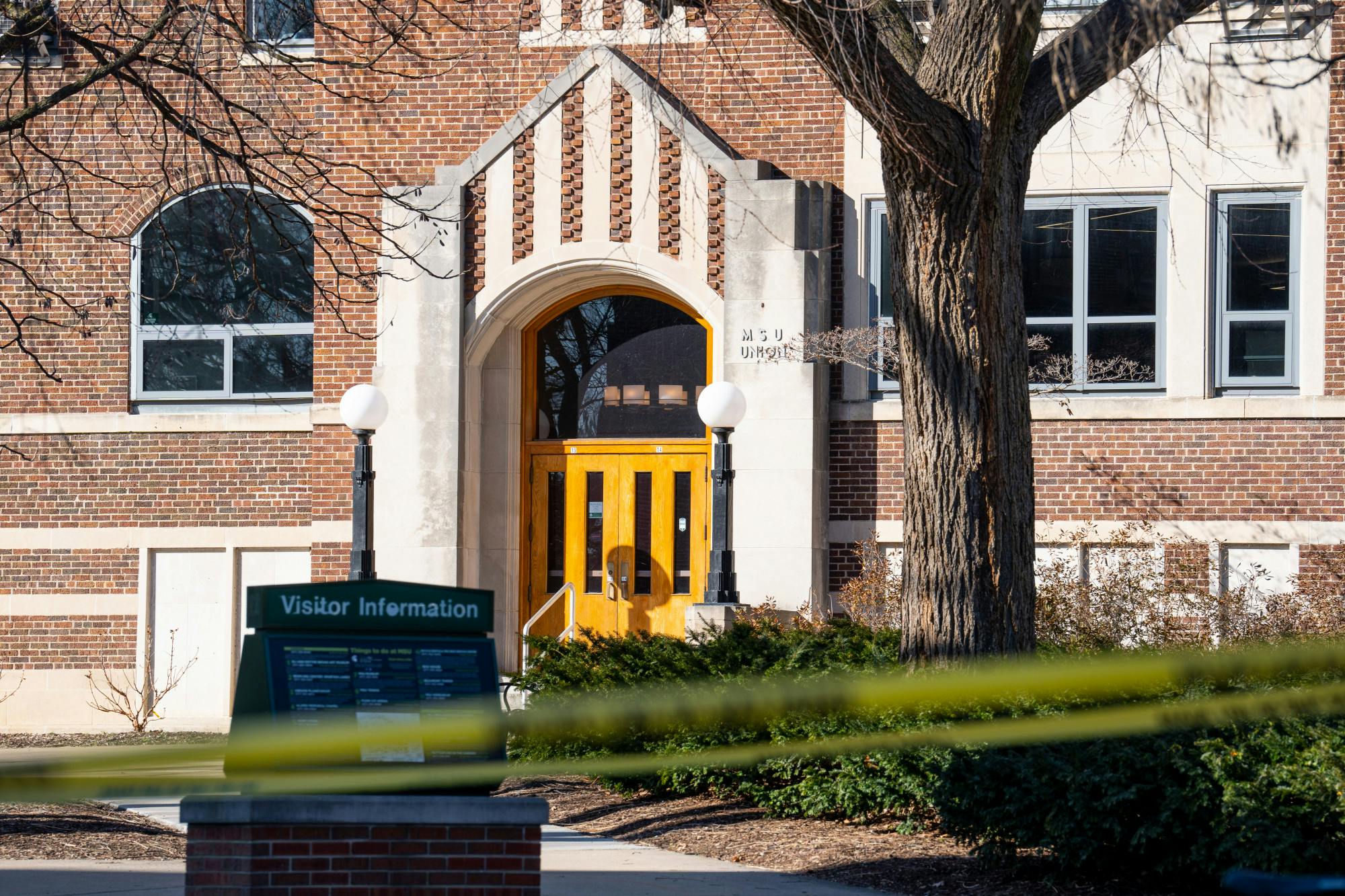 <p>Caution tape lines the outside of the Union on Feb. 14, 2023, one day after the mass shooting at Michigan State University.</p>