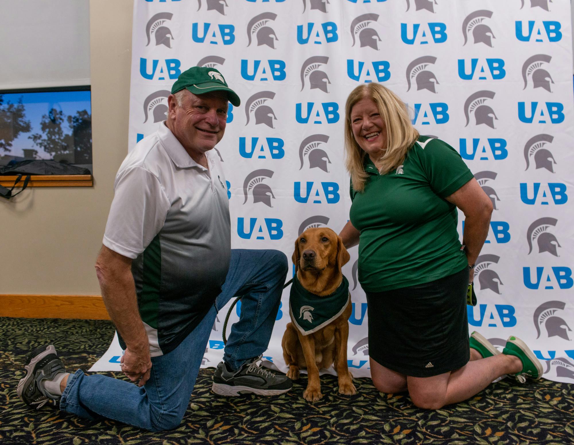 <p>Zeke&#x27;s handlers, Jim and Terri Foley, with the wonder dog at the UAB&#x27;s Zeke and Greet event on Wednesday, Sept. 29, 2021.</p>