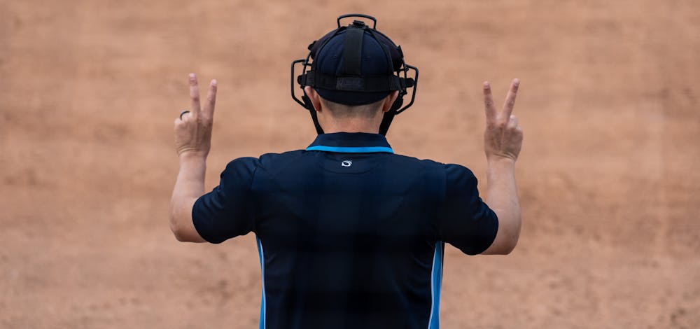 <p>An umpire holds up two fingers on each hand, signaling two strikes and two balls. The Spartans fell to the Golden Grizzlies, 10-5, on April 5, 2022. </p>