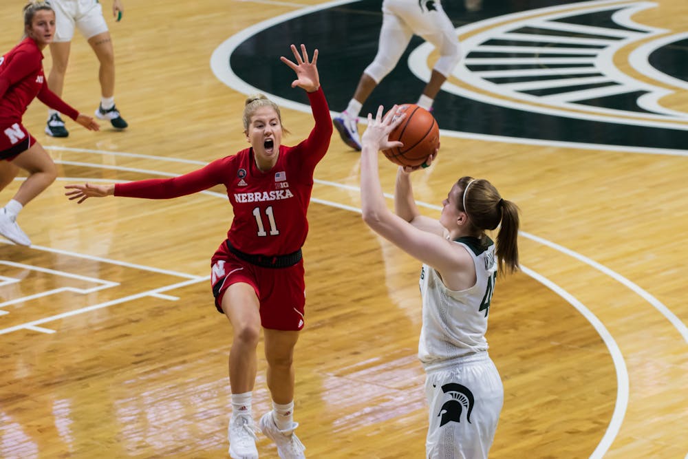 Sophomore forward Julia Ayrault shoots over Nebraska's freshman guard Ruby Porter during the Spartans' matchup with the Cornhuskers on Jan. 10, 2020.