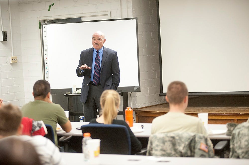 	<p>Retired U.S. Navy Admiral Dennis McGinn talks to <span class="caps">ROTC</span> members on Friday, Oct. 12, 2012 in Demonstration Hall. He campained for Proposal 3 that attempts to mandate a higher level of renewable energy tha today. Justin Wan/The State News</p>